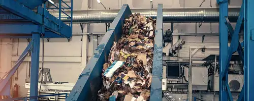 A conveyer moves waste through a processing plant