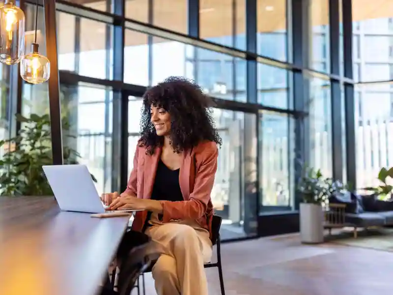 Woman using her laptop on a table.