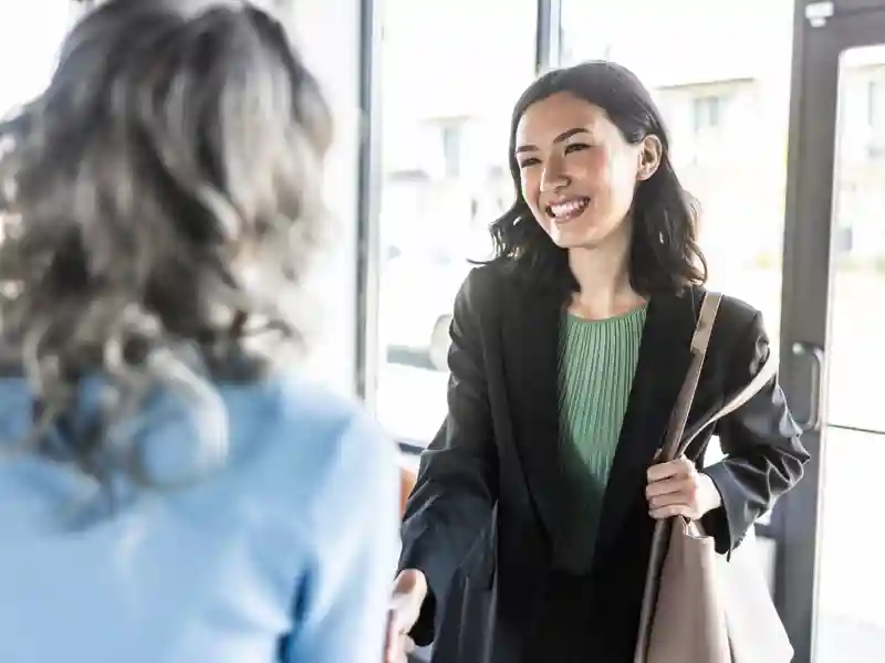 Women shaking hands.