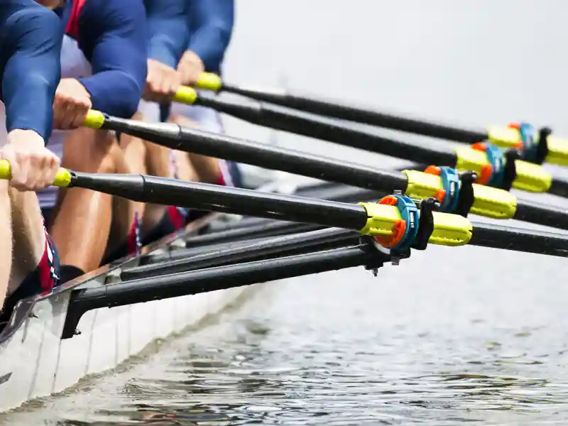 Rowers racing on water.